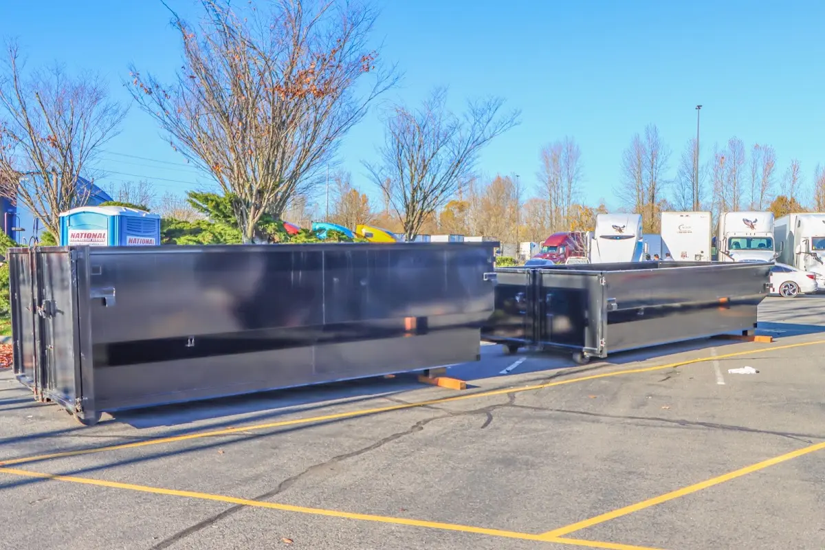 Professional dumpster rental service with roll-off container on residential driveway in Ashland City